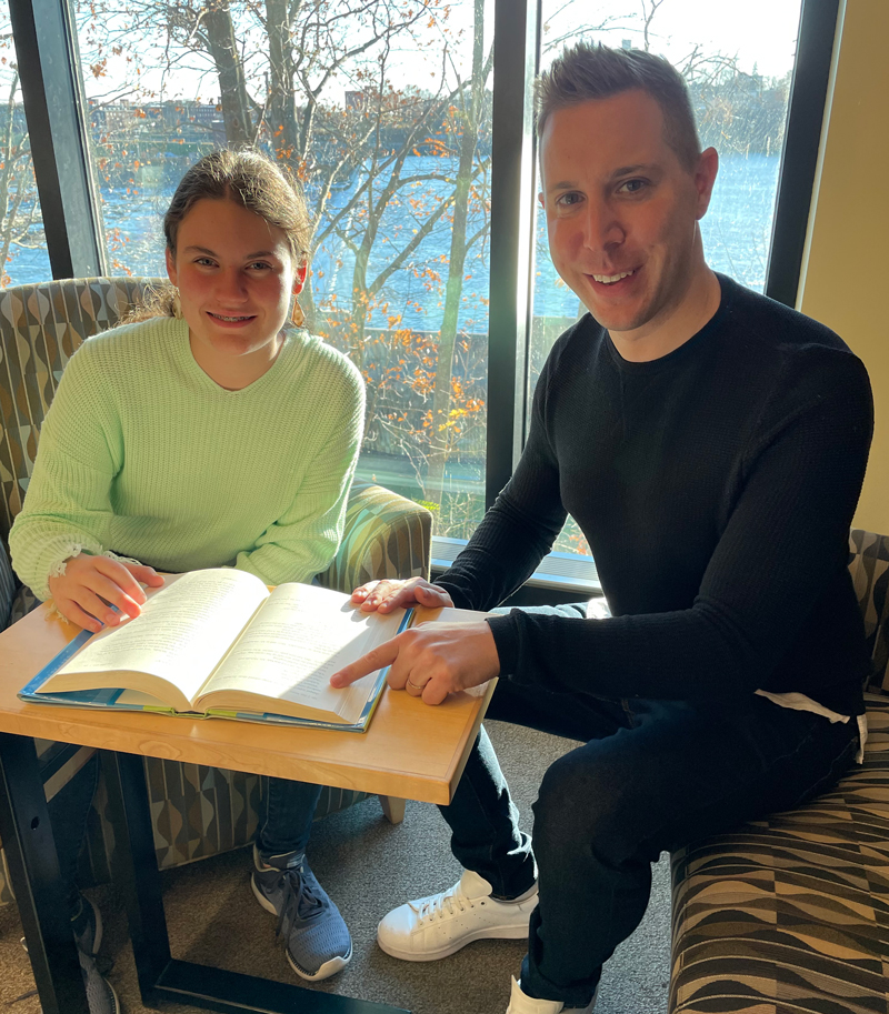 Daniel and student on a slide